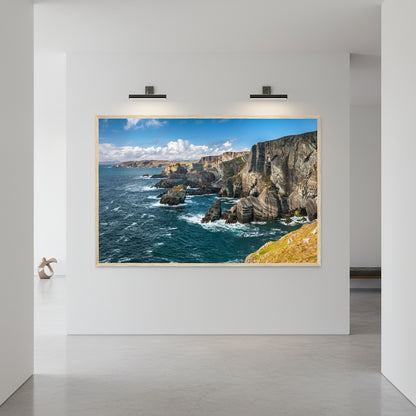 Contemporary hallway with polished concrete floors, gallery-white walls and wood-framed Mizen Head print illuminated by museum-style lighting.