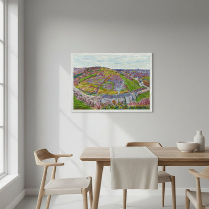 Framed landscape print Paysage, Pont Aven (1892) in a crisp white frame, hanging above a light wood dining table with simple linen runner, modern chairs, pale grey wall, natural daylight from side window, styling clean and contemporary, focus on the print.