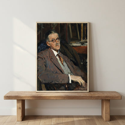 James Joyce portrait in a natural wood frame leaning against an off-white wall on a rustic wooden shelf, subtle warm light, soft shadow falloff, neutral interior styling, premium fine art emphasis.