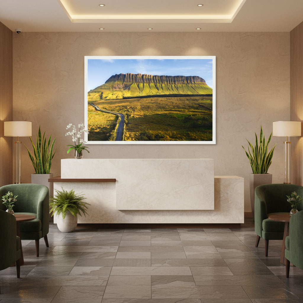 Large Benbulben framed print in a boutique Irish hotel lobby, styled with slate floors, limestone reception desk, and fresh greenery.