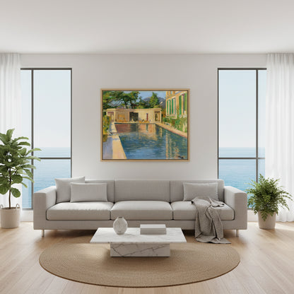 Swimming Pool, Southern France – Sir John Lavery Collector’s Print. Collector’s Edition framed “Swimming Pool, Southern France” above a modern sofa in a bright coastal apartment with big windows, sea-light ambience, minimalist decor.